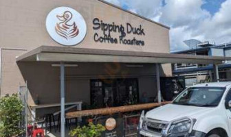 Sipping Duck Coffee Stratford outside