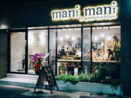 Mani Mani outside
